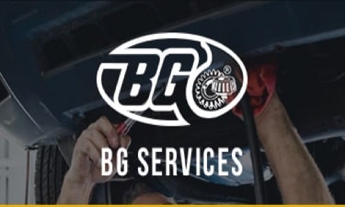 BG Services logo and text image overlay with mechanic hands holding wrench in background