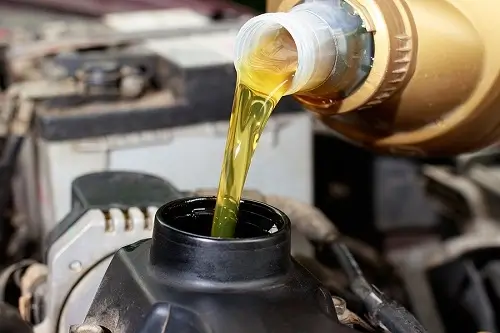 Oil Change | Bock Auto in Amagansett, NY. Image of fresh oil poured into an engine.
