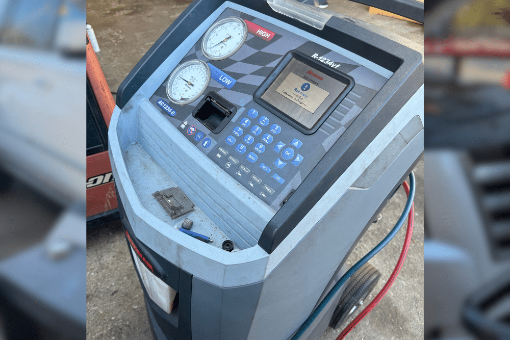 Auto air conditioning repair in Amagansett, NY at Bock Auto. Image of automotive A/C recharge machine with pressure gauges and recovery system, highlighting professional air conditioning diagnostics and cooling performance.